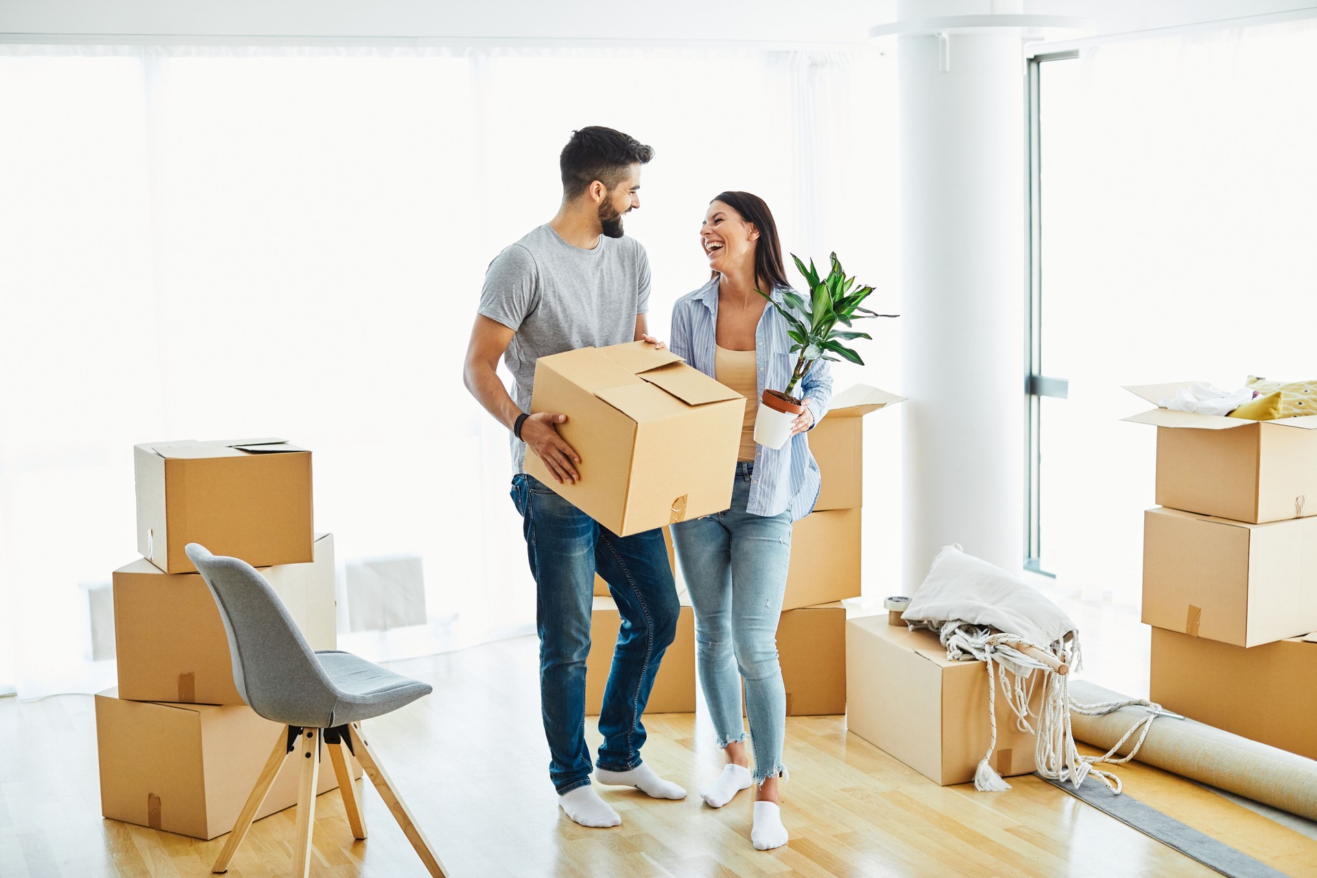 woman couple man box home house moving happy apartment together romantic relocation new property